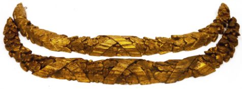 Four carved giltwood swags, each of arc form and carved with oak leaves, acorns and ribbons, wall