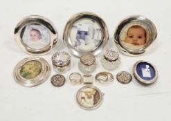 Four silver circular easel back photograph frames including two matching Sheffield 1983 and 1992,