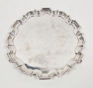 George VI silver card tray, London 1937, Garrard & Co, having a scalloped edge, on three scrolling