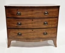 Early 19th century mahogany bowfronted chest having three long graduated cockbeaded drawers with