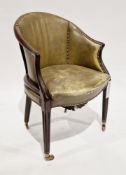 Edwardian-style club chair with green leather studded upholstery, shaped arms, on reeded tapering