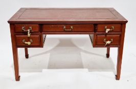 Chinese hardwood writing desk, having an arrangement of four drawers with brass geometric drop