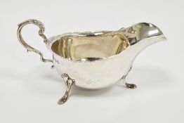 George V silver sauceboat, Glasgow 1923, James Weir, of plain form with wavy edge, scroll handle