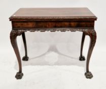 Georgian revival Chippendale-style mahogany fold-over card table, the rectangular top opening to a