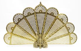 Mid-century Victorian style brass folding peacock fire screen, with pierced panels and the stand