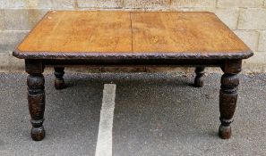 Victorian oak extending wind-out dining table, the rectangular top with canted corners and carved