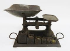 Victorian cast iron set of scales and weight, with twin loop handles and weights ranging from 1lb to