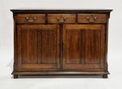 George III oak dresser base, possibly from North Wales, the rectangular top with thumbmould edge,
