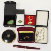 Collection of jewellery and collectable items including carved jade pendant in white metal
