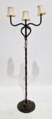 Mid-century metal standard lamp having a black finish, comprising three branches and a stepped