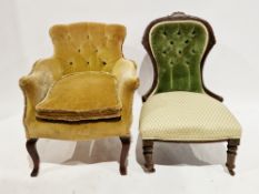 Early 20th century armchair upholstered in a mustard button back fabric, on scrolling front legs,