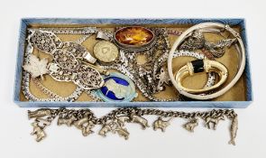 Collection of silver jewellery including hinged bangle, religious enamelled bar brooch, carved amber