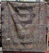 20th century silk Persian rug, the centre with a large radiating foliate medallion in blue, pink and