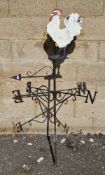 Black painted scrollwork weather vane with white painted rooster atop 152cm overall Condition Report