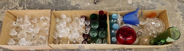 Three boxes of assorted glassware including a set of six green glass beakers and other coloured