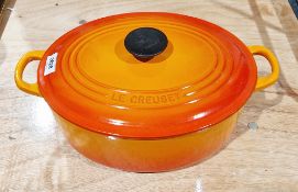 Le Creuset orange oval casserole and cover  Condition Report The approx sixe of the dish including