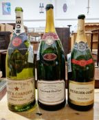 An empty Moet & Chandon imperial size champagne bottle, another empty Laurent-Perrier Salmanazar