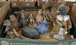 Quantity of studio pottery models including a figure of a lady in a bonnet with a dog, signed with