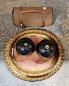 Pair of Taylor Rolph ebony bowling balls in canvas and leather case and an oval gilt frame (2)