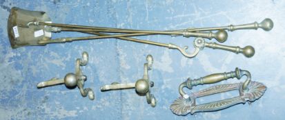 Pair of wrought iron andirons, a set of brass fire tongs, etc, an early 20th century brass letterbox