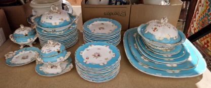 19th century porcelain dinner service painted with floral decoration within turquoise and gilt rims,