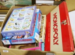 Box of assorted jigsaws, board games, etc