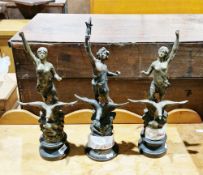 Pair of spelter models of ladies standing on eagles, 44cm high and another similar (3)