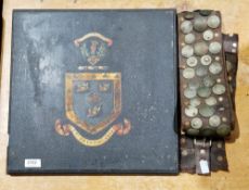 Wooden panel painted with a coat of arms with motto 38cm x 39cm and a leather belt with empire