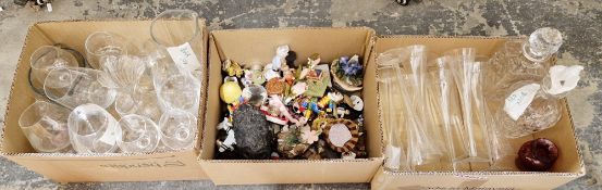 Three boxes of assorted glassware and ornaments including a set of etched glass flutes, porcelain