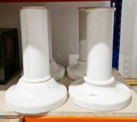Two pairs of marble supports of cylindrical form, on circular bases, one pair 34cm high the other