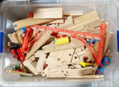 Box of modern Brio children's wooden train track and accessories