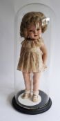 Shirley Temple doll with hazel eyes, lashes and open mouth with row of upper teeth, short blonde