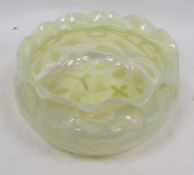 Late 19th century vaseline bowl of squat globular form, with frilled rim, mould blown with