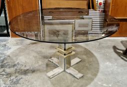 In the manner of Banci Firenze a mid-20th century Italian circular dining table having a smoky glass