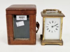 French gilt-brass carriage clock, with four bevelled edged glass panels to sides and glass panel