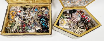 Two sewing baskets containing a large quantity of costume jewellery including brooches, bead
