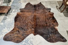 Large brown cow hide, labelled for Hanlin Ltd, marked Assorted Hides, 234cm long x 155cm wide