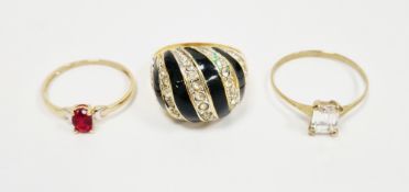 9ct yellow gold ring, claw set with an oval mixed cut red stone, size Q, 9ct yellow ring, claw set