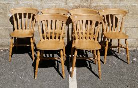 Set of six beechwood lathback kitchen chairs on turned and ringed legs united by an H-stretcher,