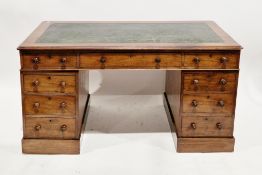 Victorian mahogany twin-pedestal writing desk, the rectangular top with ogee moulded edge and