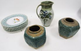 Studio pottery jug by Tom Ferguson, painted with green and blue leafy branches, incised signature