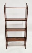 Early 20th century stained pine bookcase having four open backed shelves, 135cm high x 59.5cm wide x