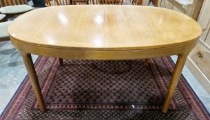 Parker Knoll teak oval dining table extending with a pull-up leaf, on square tapering legs, 76cm
