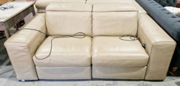 Italian Natuzzi brown leather upholstered two-seater reclining sofa formed in two sections, with