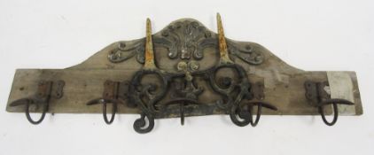 19th century style cast iron boot scraper with pierced scrolling design having two prongs to set
