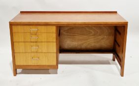 Mid-century Remploy teak single pedestal desk, the rectangular top with low back upstand and the