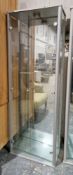 Modern glass display cabinet of rectangular with two doors opening to four adjustable shelves,