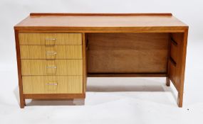 Mid-century Remploy teak single pedestal desk, the rectangular top with low back upstand and the