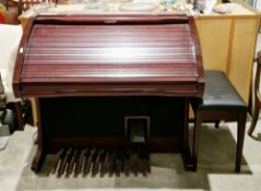 Lowrey Virtual Orchestra Inspire organ, model EY400, in a stained walnut case with roll top front,