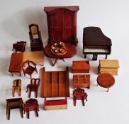One box of doll's house furniture to include grand piano, Mule chest, Mirror, wardrobe, dining